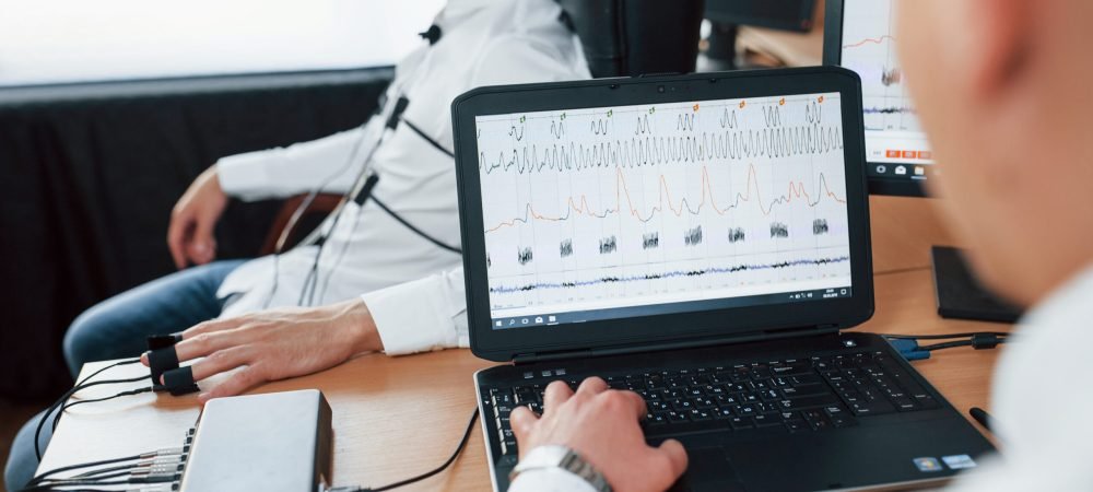 Did you saw when your neighbor is leave his house. Suspicious man passes lie detector in the office. Asking questions. Polygraph test.